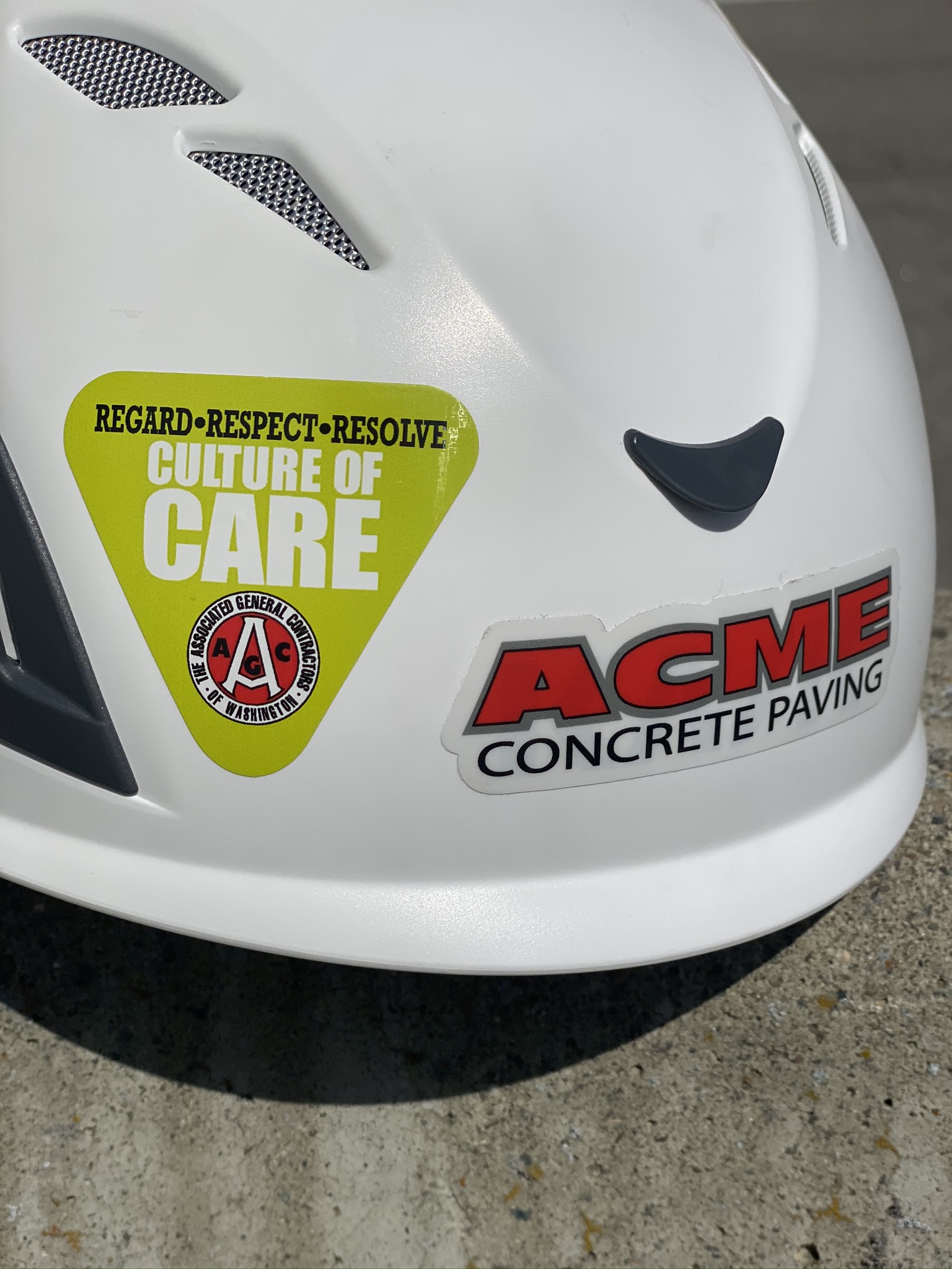 work helmet with ACME sticker