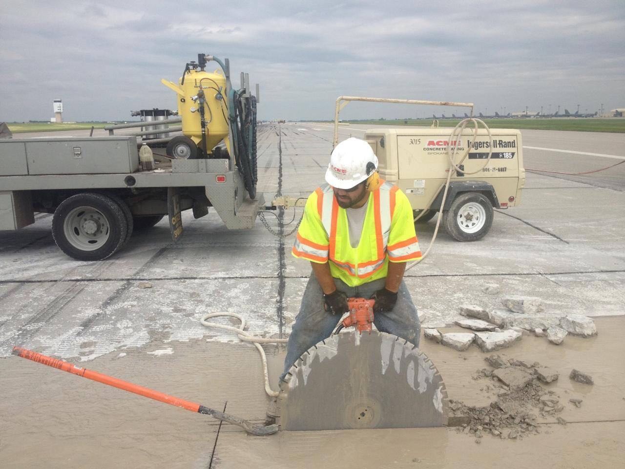 man cutting concrete